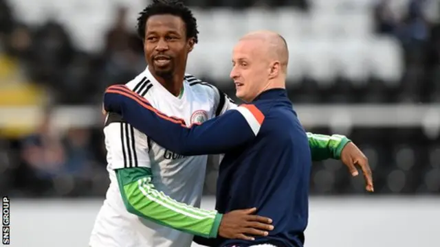 Celtic team-mates Efe Ambrose and Leigh Griffiths share a wee cuddle at Craven Cottage.