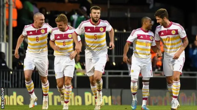 Scotland celebrate Charlie Mulgrew's early goal