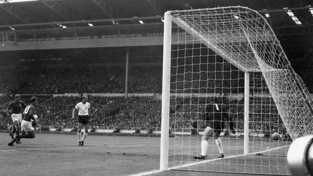 Geoff Hurst heads in to make it 1-0 England