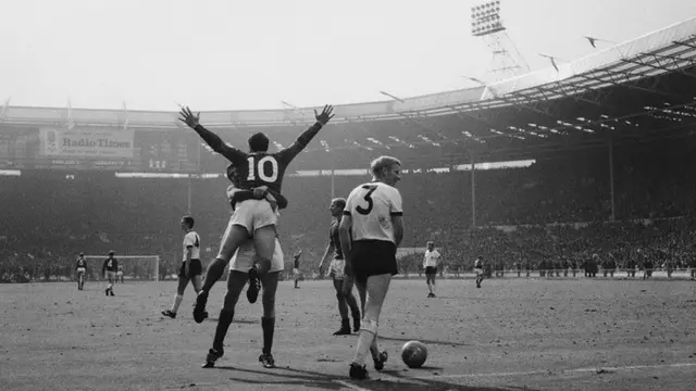 Geoff Hurst celebrates after his controversial third goal is given in the 1966 World Cup final