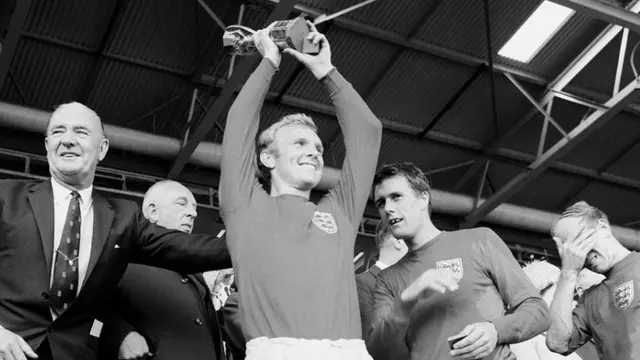 England captain Bobby Moore lifts the Jules Rimet trophy