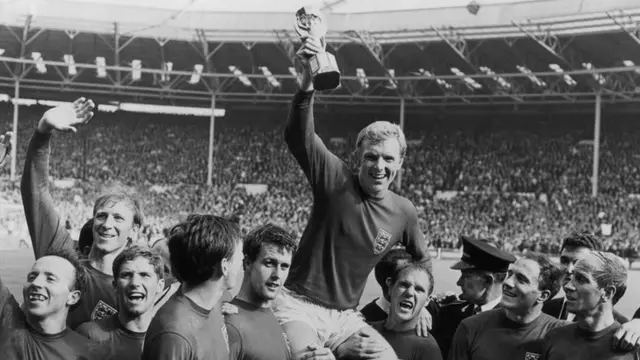 England captain Bobby Moore is held aloft by his players