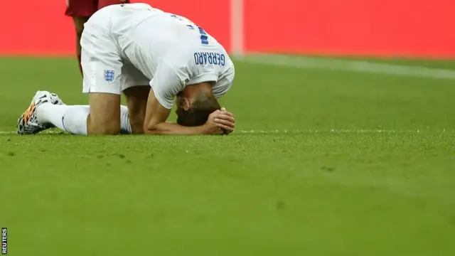 Steven Gerrard reacts after being tackled