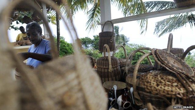 Woman selling baskets in Dominica