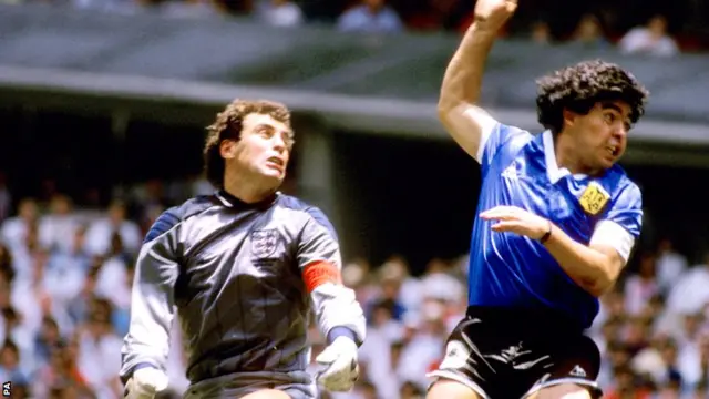 Diego Maradona scores Argentina's first goal of the World Cup quarter-final