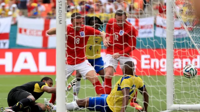 Wayne Rooney scrambles home the equaliser for England in their match against Ecuador