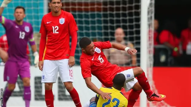 Alex Oxlade-Chamberlain tumbles to the ground