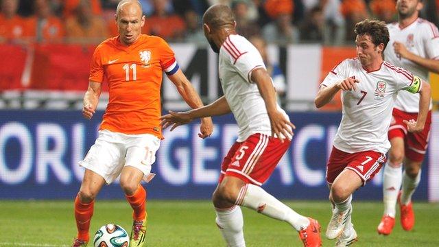 Arjen Robben of the Netherlands takes on Wales