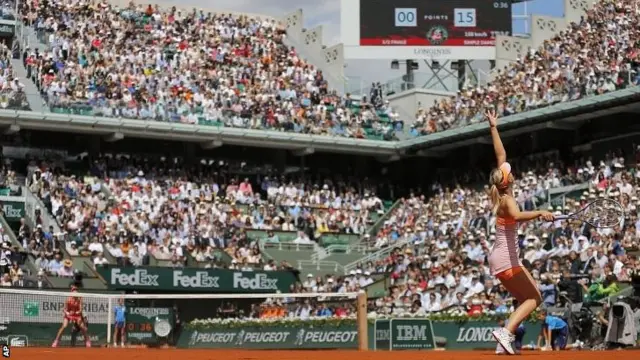 Maria Sharapova serves