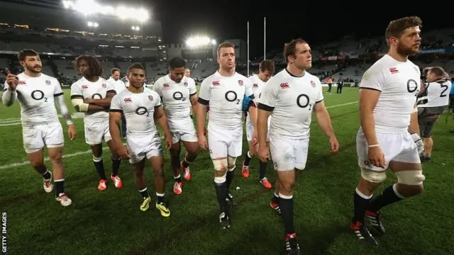 England walk off at the end of a bruising encounter