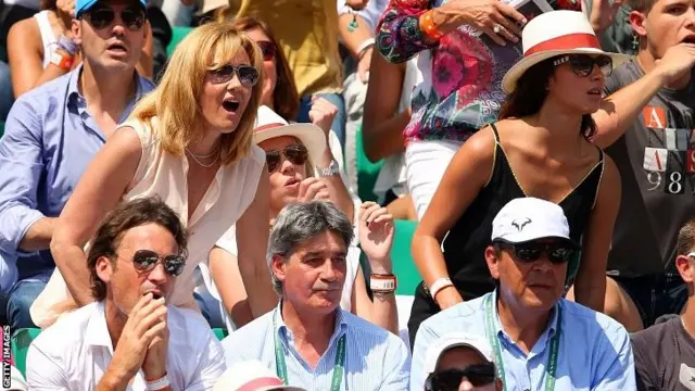 Rafael Nadal's mother Ana Maria Parera (L), sister Maria Isabel Nadal (C), girlfriend Xisca Perello (R) and father Sebastian Nadal (bottom R)