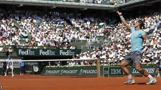 Rafael Nadal serves