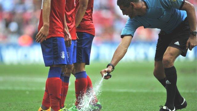 New Zealand referee Peter O Laary sprays the grass before a free-kick during a match between South Korea and Nigeria at last year's Under-20 World Cup