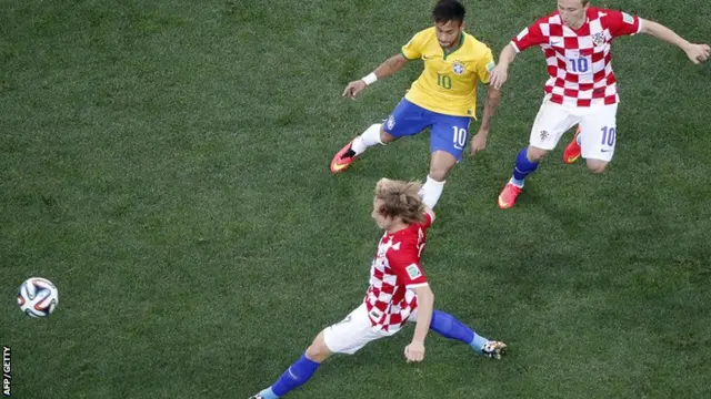 Neymar tussles for the ball with Croatia players