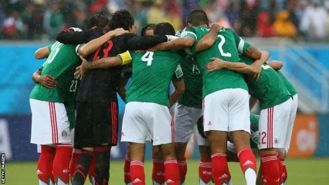 Mexico have a team huddle