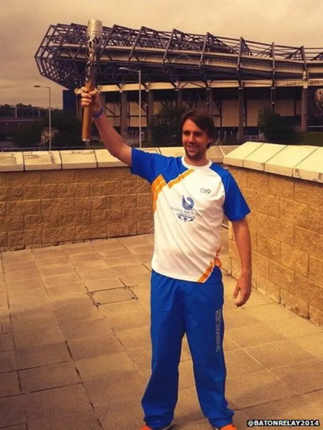 Baton bearer at Murrayfield Station