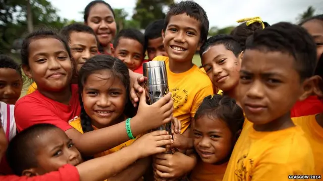 Children hold the baton in Tonga