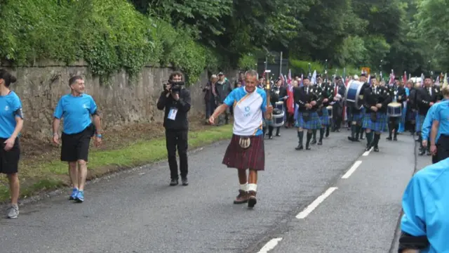 David Laing hold the Queen's baton in Coldstream