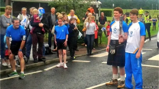 HeriotWatt students carry baton