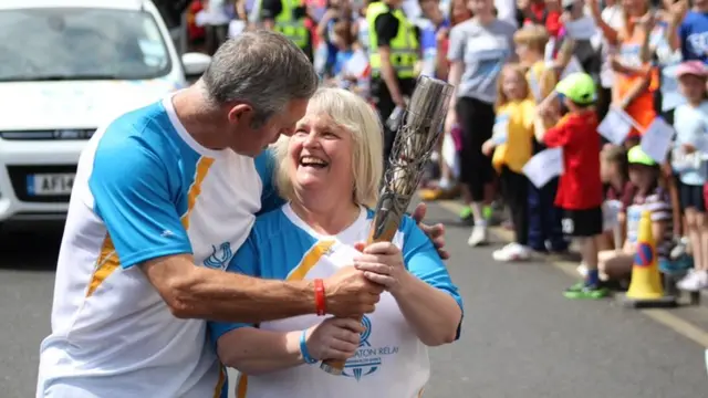 Gavin Hastings and Lynne McNicoll with the Queen's Baton Relay in Edinburgh