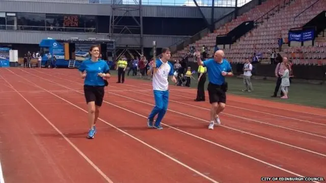 Runners with Queen's baton