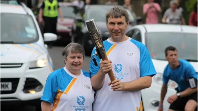 Male and female baton bearers