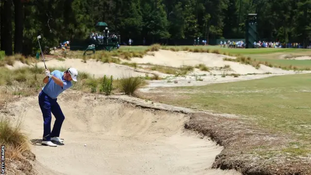 Graeme McDowall plays a bunker shot at Pinehurst