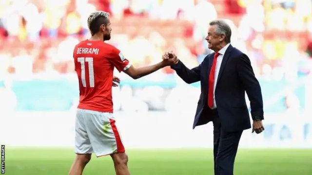 Valon Behrami of Switzerland and Ottmar Hitzfeld