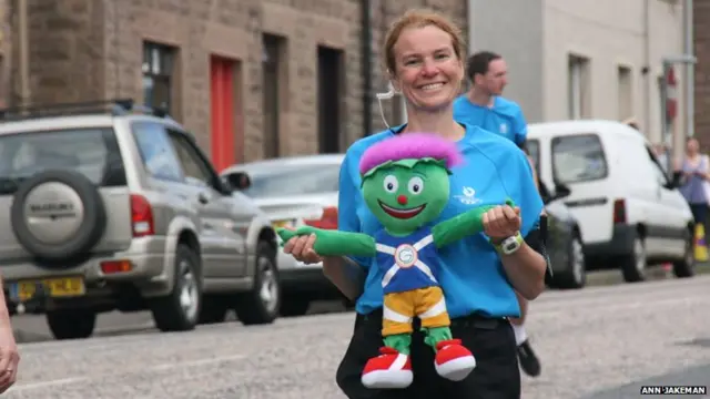 Police escort posing with cuddly toy