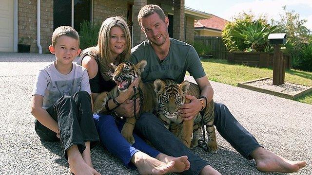 Giles Clark with wife Kerri, son Kynan and tiger cubs