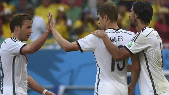 Germany"s forward Mario Goetze Germany's forward Thomas Mueller and Germany's midfielder Sami Khedira celebrate