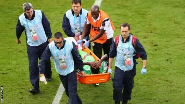 Godfrey Oboabona of Nigeriais stretchered off the field