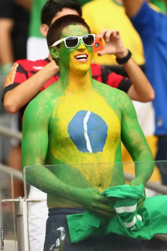 A Brazil fan watches on