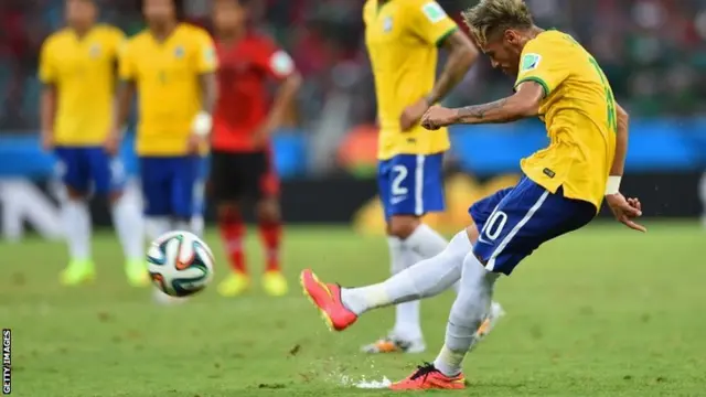 Neymar of Brazil takes a free kick