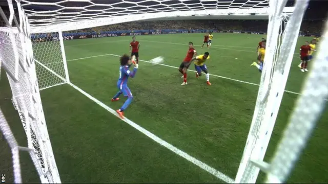 Mexico's keeper Guillermo Ochoa punches the ball clear