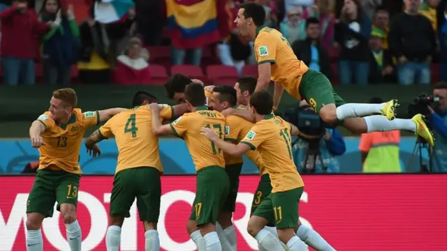 Australia celebrate as Mile Jedinak scores a penalty against Netherlands