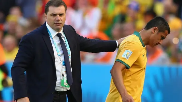 Tim Cahill is consoled by his manager after Australia's 3-2 loss to Netherlands