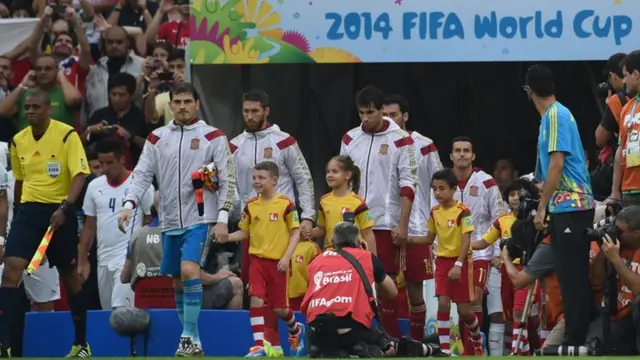 Spain captain Iker Casillas leads his team out against Chile