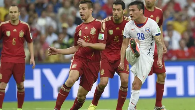 Charles Aranguiz pokes home Chile's second against Spain