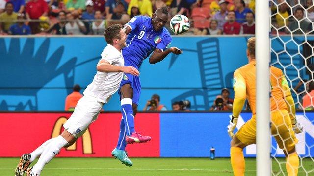 Italy's Mario Balotielli heads the winner past England's Joe Hart