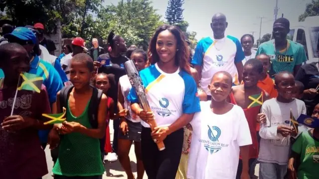 Shelly-Ann Fraser-Pryce pictured with the Queen's Baton