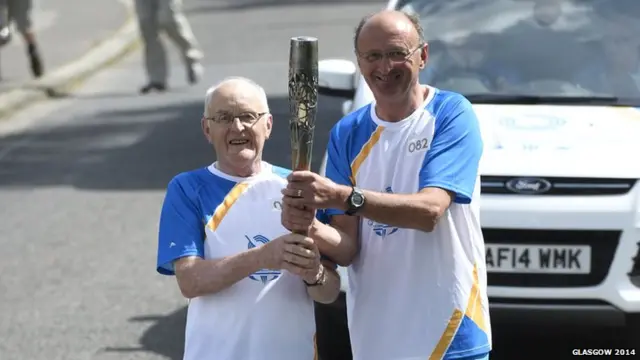 Billy Green and Alexander Barclay pose with the baton