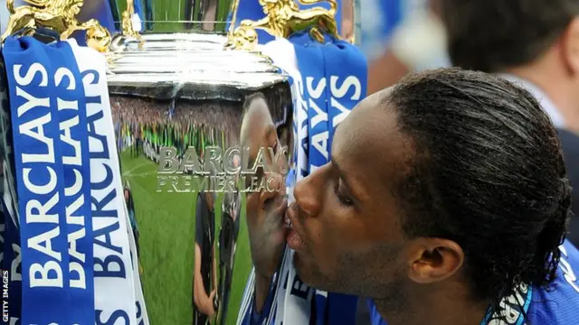 Didier Drogba with the Premier League trophy in 2010