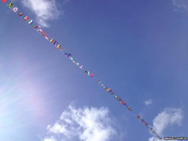 Commonwealth flags in blue skies