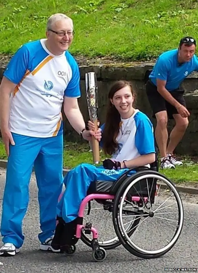 Shelby Watson being handed to the baton this morning in Langholm