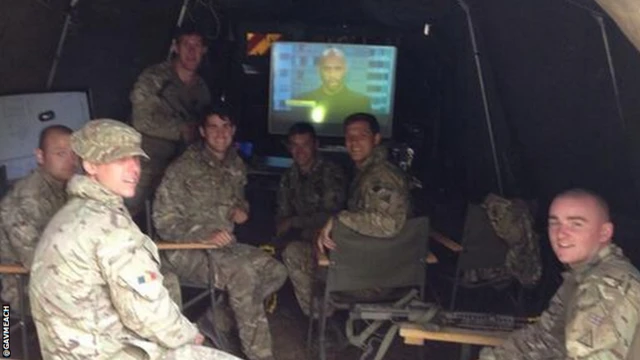 Soldiers watch televison