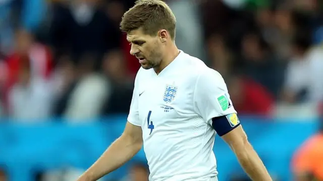 Steven Gerrard walks England out