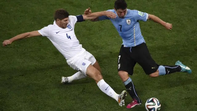 Steven Gerrard fouls Cristian Rodriguez