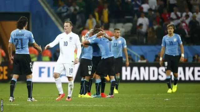 Wayne Rooney and Uruguay players