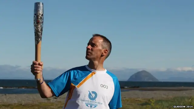 Nicholas Taylor with the Queen's Baton